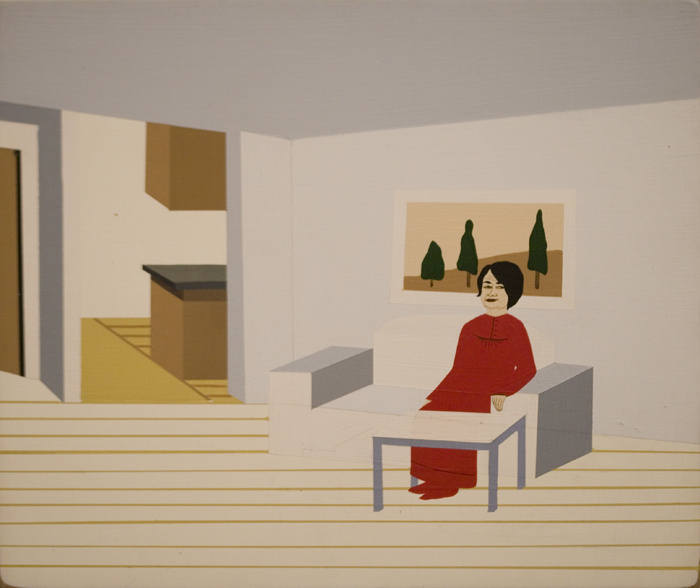 A painting of a woman in a red dress sitting on a white bench in front of a picture of 3 trees. Her arm lays on the arm rest. A white coffee table is in front of her. In the background is another room with a counter and cabinet.
